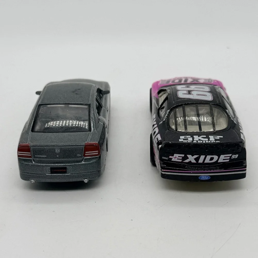2006 Dodge Charger & #99 Exide Batteries Ford Taurus NASCAR Diecast Cars - Lot 2
